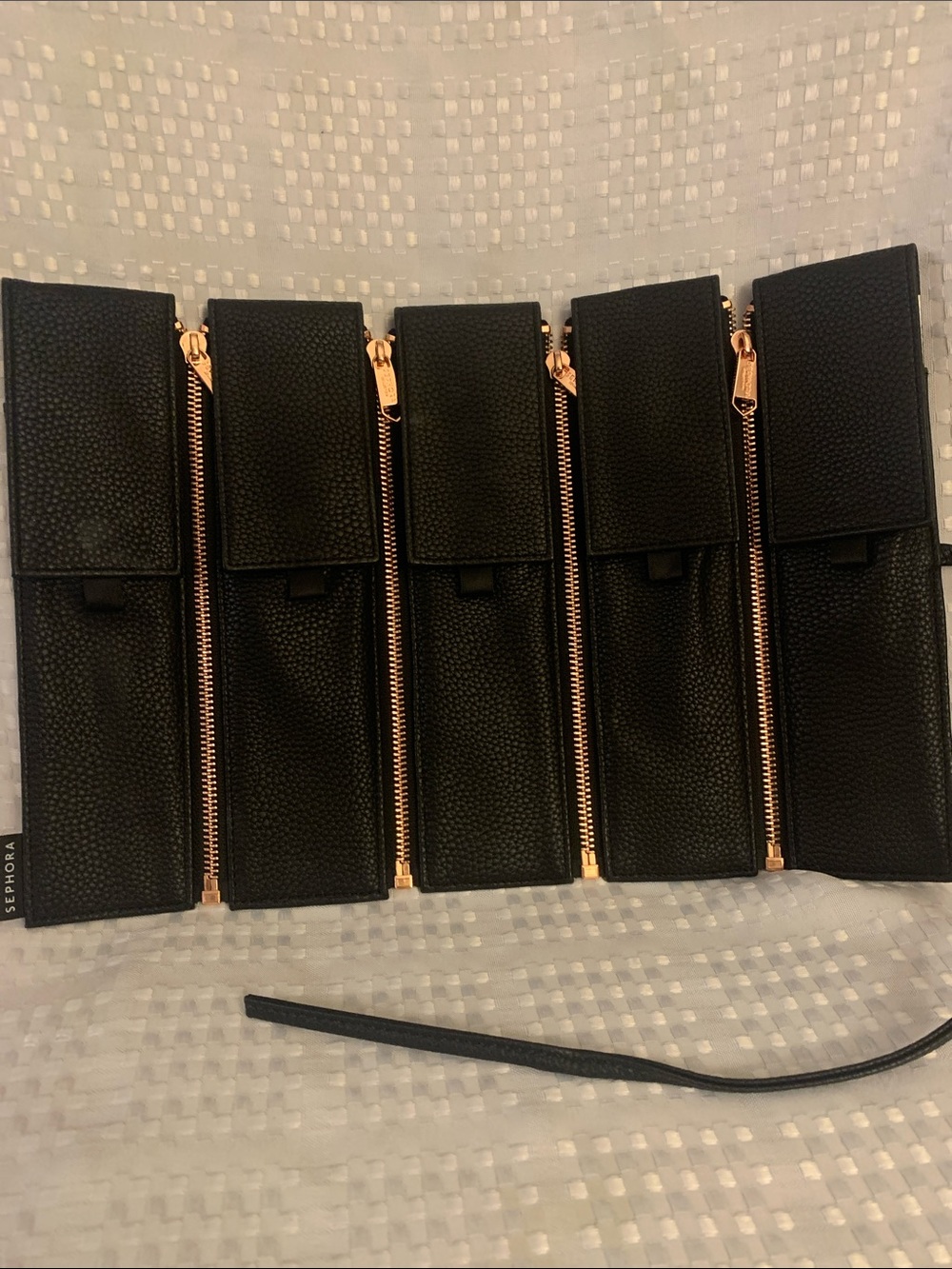 Sephora black cosmetic brush holders with gold zippers.9.5 in. high, 14 in. wide